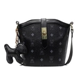 Classic black bucket bag with vintage bear print, gold buckle, and puppy charm detail - Black With Dog Charm
