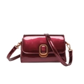 Elegant burgundy patent leather crossbody bag with gold buckle on white background - Red