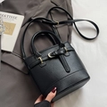 Minimalist black lychee texture leather bucket bag with dual handles and gold hardware - Black - Without Pendant