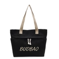 Borsa tote in tela nera con manici beige, ricamo del marchio e dettaglio nappa - Nero