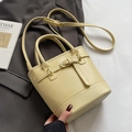 Pale yellow litchi pattern bucket bag with double handles and gold metal hardware finish - Yellow - No Pendant