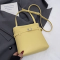 Minimalist pale yellow bucket bag with lychee texture and silver buckle detail - Yellow (Without Charm)
