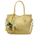 Pale yellow lychee texture leather bucket bag with horse charm and top handles - Yellow with Yellow Pegasus Charm