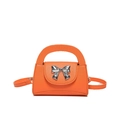 Trendy bright orange lychee leather mini crossbody bag with silver metal bow decoration - Orange