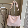 Pink minimalist crossbody tote bag with adjustable strap and front brand label - Pink - No Pendant