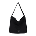 Minimalist black canvas hobo tote bag with wide shoulder strap and woven brand label - Black