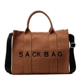 Brown canvas tote bag with black SACK BAG print and adjustable nylon shoulder strap - Brown