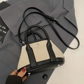 Borsa a secchiello bicolore in pelle litchi nera e tessuto intrecciato beige - Nero Piccolo (Senza Ciondolo)
