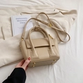 Beige faux leather bucket bag with top handles and adjustable strap for daily use - Khaki