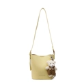 Pale yellow litchi grain leather bucket bag with a cute white plush bear pendant charm - Yellow With Bear Charm