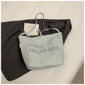 Hellblaue Canvas-Tragetasche mit Paris Hello-Schriftzug und Kordelzugverschluss - Blau