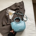 Light blue marbled PU leather bucket bag with a round handle and adjustable strap - Blue Without Charm