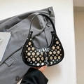 Black crescent shoulder bag with silver studs and glossy patent leather finish - Black