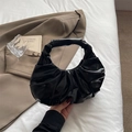 Minimalist black patent leather pleated handbag with a crescent cloud bag design - Black