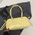 Elegant light yellow baguette bag with side bow accents on a dark suit background - No Pendant / Yellow