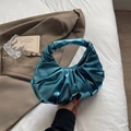 Chic metallic blue pleated handbag with a unique cloud-shaped design and glossy finish - Blue