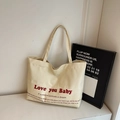 Minimalist creamy white canvas tote bag with red Love you Baby artistic lettering print - Off White