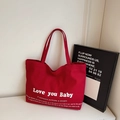 Vibrant red large canvas tote bag featuring white Love You Baby script for daily commute - Red