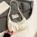 Chic beige patent leather shoulder bag with decorative bow and lace-up details - White