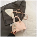 Pink shell handbag in pebbled leather with lace trim and pearl heart charm - With Charm / Pink