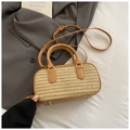 Detail of woven straw handbag with camel leather trim and elegant golden hardware - Milk Tea Apricot