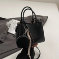 Minimalist black bucket bag with lychee texture and round coin purse accessory - Black With Pendant