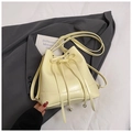 Minimalist light yellow PU leather bucket bag with a bow and adjustable strap - Yellow (No Pendant)