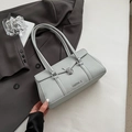 Light grey pebble leather underarm bag with metal lock buckle and brand lettering - Haze Blue