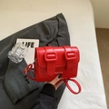 Chic red matte leather Cambridge crossbody bag with vintage buckle straps and long shoulder strap - Red