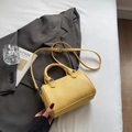 Yellow litchi pattern leather cylinder handbag with adjustable crossbody strap - No Pendant / Yellow