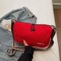 Fashionable red dumpling crossbody bag with striped webbing strap and double zipper detail - Red