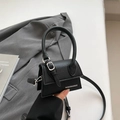 Mini black lychee leather crossbody bag with top handle and silver buckle detail - Black