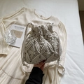 Chic cream white macrame bucket bag with intricate woven diamond patterns and drawstring closure - White
