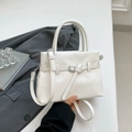 White lychee pattern leather handbag with adjustable crossbody strap and top handles - White