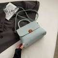Minimalist light blue leather crossbody bag with vintage gold clasp and top handle - Blue