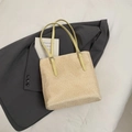 Handwoven straw tote bag with bright yellow leather straps on a white background - Yellow without Pendant