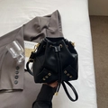 Minimalist black bucket bag in litchi grain texture with gold hardware and drawstring - No Pendant / Black