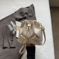Chic beige lychee grain bucket bag with drawstring closure and golden hardware - No Pendant / Off White