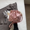 Minimalist pink bucket bag with drawstring closure and golden hardware accents - No Pendant / Pink
