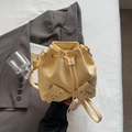 Minimalist light yellow pebble leather bucket bag with bow drawstring and gold hardware - No Pendant / Yellow