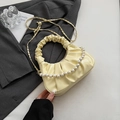 Pale yellow pleated cloud bag featuring pearl handle and gold chain strap - Yellow