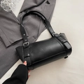 Minimalist black leather underarm bag with silver metal buckles and cylindrical design - Black