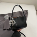 Minimalist black PU leather bucket bag with a pearl charm and key pendant - Black with Pendant
