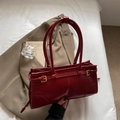 Minimalist deep red rectangular underarm bag with glossy leather finish and gold buckle - Burgundy