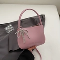 Pink minimalist underarm bucket bag with pearl bow charm and top handle strap - Magenta With Pendant