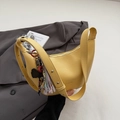 Minimalist bright yellow crescent bag with litchi texture and decorative charm - Yellow with Pendant