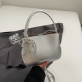 Silver matte bucket bag with pearl bow and heart charm on a minimalist background - Silver (With Pendant)
