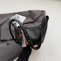 Chic black lychee grain crescent bag with colorful tassel and metal heart charm - Black with Pendant