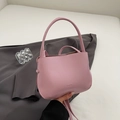 Sac seau minimaliste en cuir rose avec poignée arquée et bandoulière de style urbain - Magenta Sans Pendentif