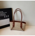 Close-up of woven straw texture with brown leather shoulder strap and decorative knot detail - Khaki